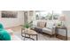 Well-lit living room with a large window, stylish decor, and an open, airy feel at 9120 Judson St, Westminster, CO 80031