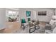 Sunlit living room with stylish chairs, modern decor, and an open layout to dining, perfect for entertaining at 9120 Judson St, Westminster, CO 80031