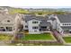 Drone shot of home with a grassy backyard, patio, and perimeter fence at 359 Rogers Way, Castle Rock, CO 80104