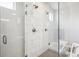 Walk in shower enclosed with glass, accented by marble tiling and dual shower heads at 359 Rogers Way, Castle Rock, CO 80104