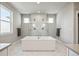 Luxurious bathroom with a soaking tub and glass-enclosed shower with dual shower heads at 359 Rogers Way, Castle Rock, CO 80104