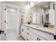 Bathroom featuring double sinks, quartz counters, and a white subway tile shower/tub combo at 359 Rogers Way, Castle Rock, CO 80104