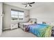 Bedroom with ceiling fan, large window, and two beds at 359 Rogers Way, Castle Rock, CO 80104