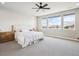 Bright and spacious bedroom featuring a ceiling fan and multiple windows at 359 Rogers Way, Castle Rock, CO 80104