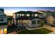 Charming two-story home boasting a covered porch, gray siding, and beautifully landscaped front yard at 359 Rogers Way, Castle Rock, CO 80104