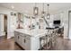 Bright kitchen with a large island, modern appliances, stylish pendant lights, and ample storage at 359 Rogers Way, Castle Rock, CO 80104