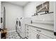 Efficient laundry room featuring side-by-side appliances and a utility sink at 359 Rogers Way, Castle Rock, CO 80104