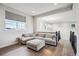 Living room featuring hardwood floors, a large window, and comfortable couch at 359 Rogers Way, Castle Rock, CO 80104