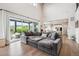 Spacious living room flows into the kitchen and features sliding glass doors to the outdoor living space at 359 Rogers Way, Castle Rock, CO 80104