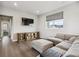 Spacious living room featuring hardwood floors, large window, and comfortable seating at 359 Rogers Way, Castle Rock, CO 80104