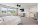 Large bedroom with a ceiling fan, many windows, and a tv over the dresser at 359 Rogers Way, Castle Rock, CO 80104