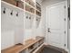 Organized mudroom with built-in shelves, hooks, and bench seating at 359 Rogers Way, Castle Rock, CO 80104