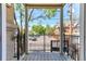 Balcony with black iron railing overlooking parking area at 1521 Vine St # 108, Denver, CO 80206