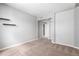Spacious carpeted bedroom with neutral walls and modern lighting at 1521 Vine St # 108, Denver, CO 80206