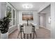 Dining room with a view of the kitchen and a large window at 1521 Vine St # 108, Denver, CO 80206