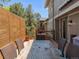Outdoor deck space with a slatted privacy wall and dining set perfect for entertaining at 5557 E Links Cir, Centennial, CO 80122