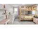 Shared bedroom featuring carpet, a bunk bed, and a desk at 5557 E Links Cir, Centennial, CO 80122