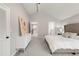 Serene bedroom showcasing a dresser and a connecting doorway to the bathroom at 5557 E Links Cir, Centennial, CO 80122