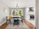 Elegant dining room boasts a modern table setting, bright natural light, and stylish décor at 5557 E Links Cir, Centennial, CO 80122