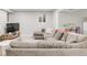 Spacious living room featuring a large sectional sofa and modern entertainment center at 5557 E Links Cir, Centennial, CO 80122
