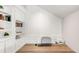 Bright home office with custom built-ins, decorative molding, and a rustic wood desktop at 5557 E Links Cir, Centennial, CO 80122