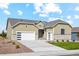 Charming one-story home with attached two car garage, stone accents, and a well-manicured lawn at 42979 Colonial Trl, Elizabeth, CO 80107