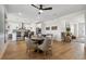 Open concept living area with hardwood floors, dining table and seating at 42979 Colonial Trl, Elizabeth, CO 80107