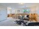 Finished basement featuring wood paneled accent wall, carpet flooring, modern furnishings, and a cozy seating area at 907 Stein St, Lafayette, CO 80026