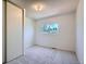 Simple bedroom with carpet, closet and window providing natural light at 907 Stein St, Lafayette, CO 80026