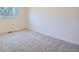 Cozy bedroom with neutral paint, carpet and a window with natural light at 907 Stein St, Lafayette, CO 80026