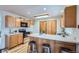 Well-lit kitchen with plenty of storage and light colored countertops at 907 Stein St, Lafayette, CO 80026