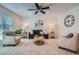 Bright living room boasts stylish furnishings, large windows, and a cozy atmosphere at 907 Stein St, Lafayette, CO 80026