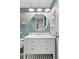 Charming bathroom featuring a modern vanity with marble countertop and brushed nickel hardware, enhanced by soft lighting at 209 Wright St # 204, Lakewood, CO 80228