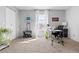 Bright, open bedroom with neutral walls, carpet, and a large window for natural light, ideal for a home office or gym at 209 Wright St # 204, Lakewood, CO 80228