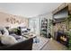 Comfortable living room with stone fireplace, decorative shelves, and access to a balcony at 209 Wright St # 204, Lakewood, CO 80228