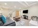 Finished basement with TV, seating, and game area at 7902 E 49Th Pl, Denver, CO 80238