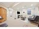Finished basement recreation area with seating, TV, and game table at 7902 E 49Th Pl, Denver, CO 80238