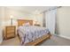 Basement bedroom with wooden bed frame and nightstands at 7902 E 49Th Pl, Denver, CO 80238