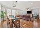 Open concept dining area adjacent to living room and kitchen at 7902 E 49Th Pl, Denver, CO 80238