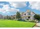 Row of charming two-story homes with green lawns at 7902 E 49Th Pl, Denver, CO 80238