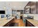 Spacious kitchen featuring granite countertops, stainless steel appliances, and ample cabinetry at 7902 E 49Th Pl, Denver, CO 80238