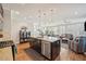 Spacious kitchen with an island, stainless steel appliances, and granite countertops at 7902 E 49Th Pl, Denver, CO 80238
