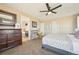Main bedroom with en-suite bathroom and a view of the backyard at 7902 E 49Th Pl, Denver, CO 80238