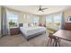 Large main bedroom with ample natural light and en-suite bathroom at 7902 E 49Th Pl, Denver, CO 80238