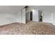 Large attic space featuring sloped ceilings and doors to a closet and bathroom at 2701 W Mississippi Ave, Denver, CO 80219