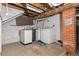Unfinished basement laundry area with washer and dryer hookups at 2701 W Mississippi Ave, Denver, CO 80219