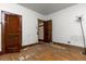 Bedroom with hardwood floors, lamp, and large closet space at 2701 W Mississippi Ave, Denver, CO 80219