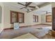 Spacious living room showcasing hardwood floors, vintage details and boarded windows at 2701 W Mississippi Ave, Denver, CO 80219