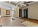 Large living room with hardwood floors, classic details, and a partial view of a staircase at 2701 W Mississippi Ave, Denver, CO 80219