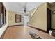View of the living room with hardwood floors, a staircase, and natural light at 2701 W Mississippi Ave, Denver, CO 80219